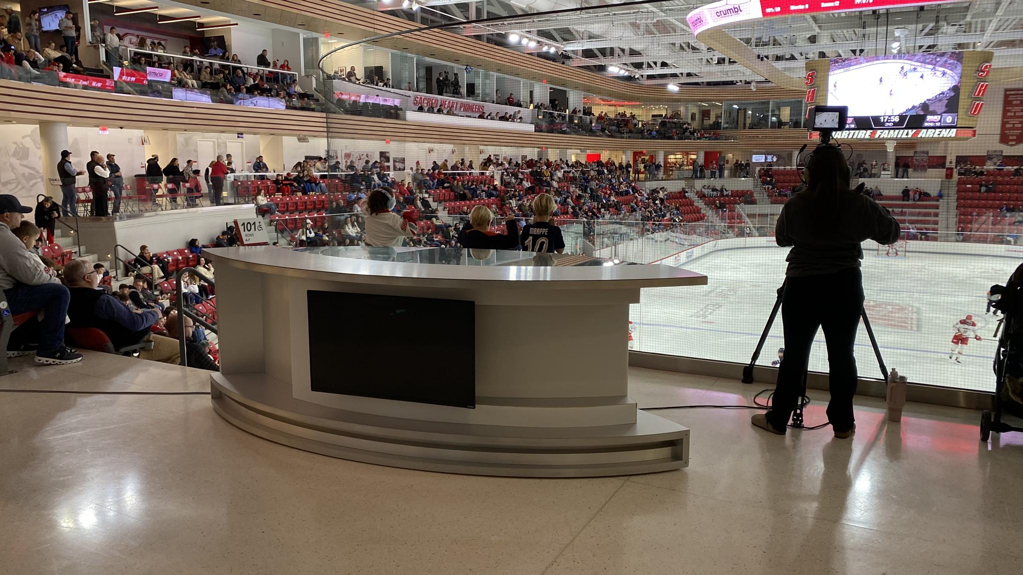 An image of a desk with a monitor attached to its front