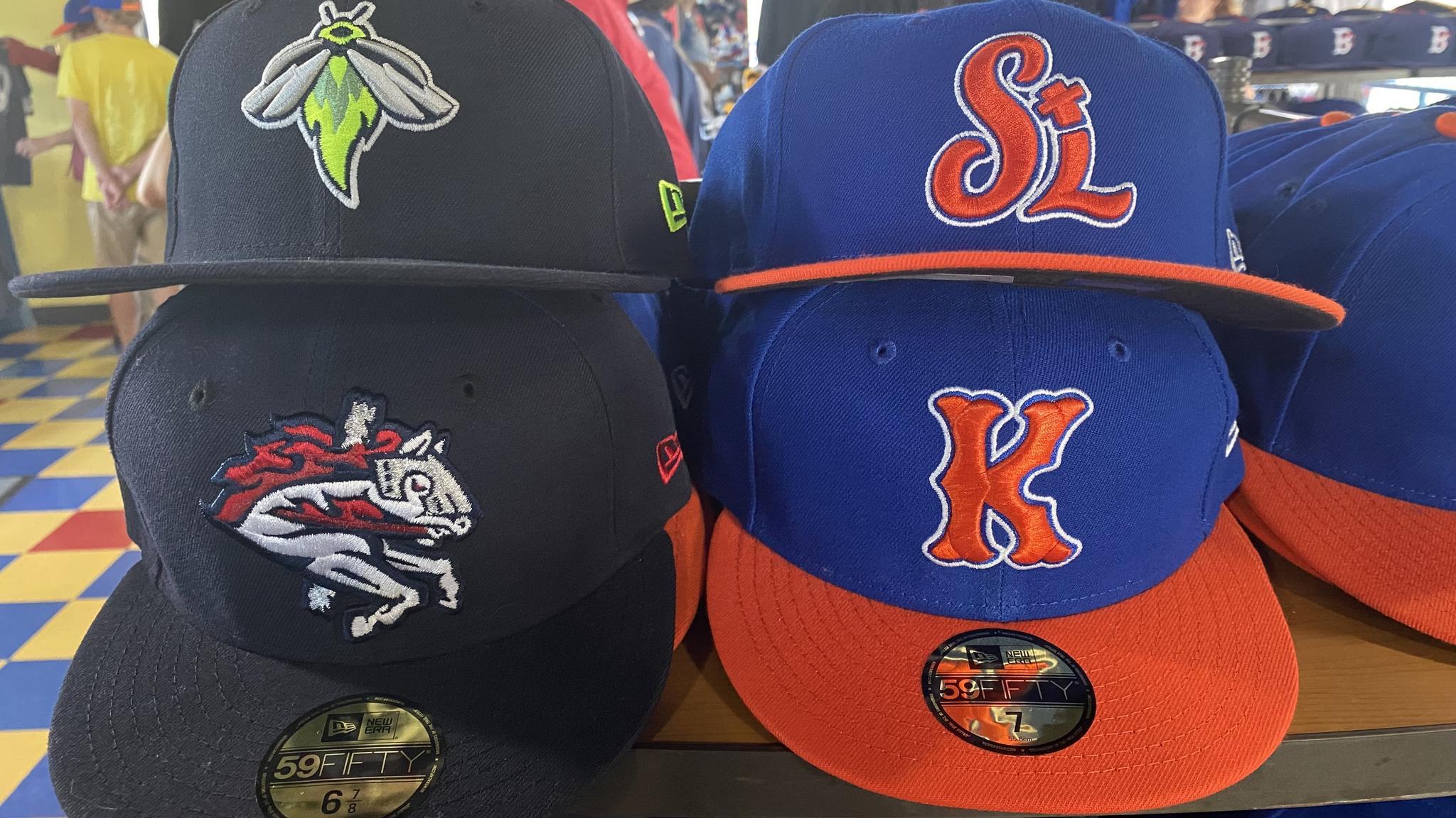 Four hats - none of which are Brooklyn Cyclones hats. The hats are for the Columbia Fireflies (top left), St. Lucie Mets (top right), Binghamton Rumble Ponies (bottom left), and Kingsport Mets (bottom right)