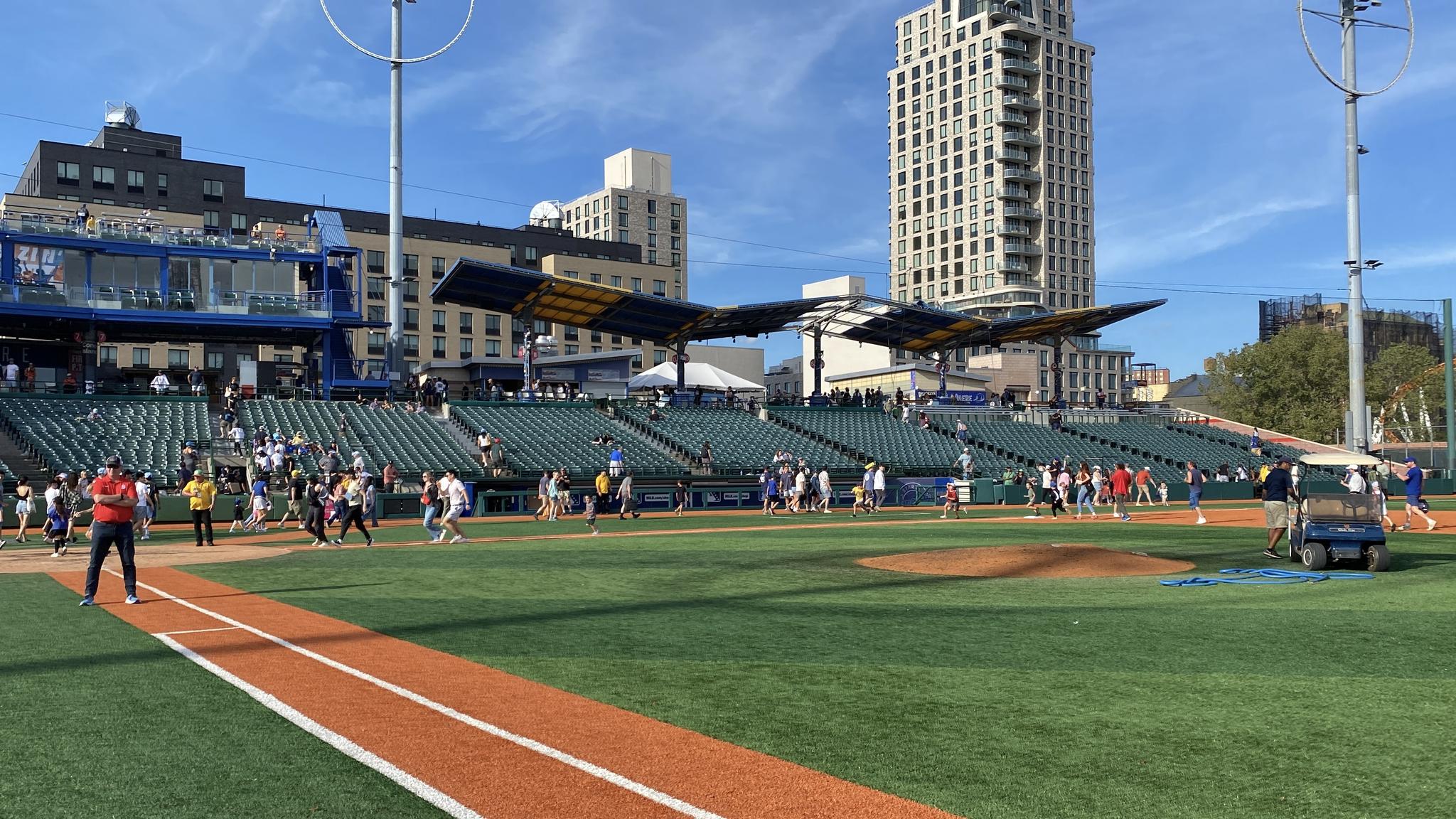 Fans running the bases after the game