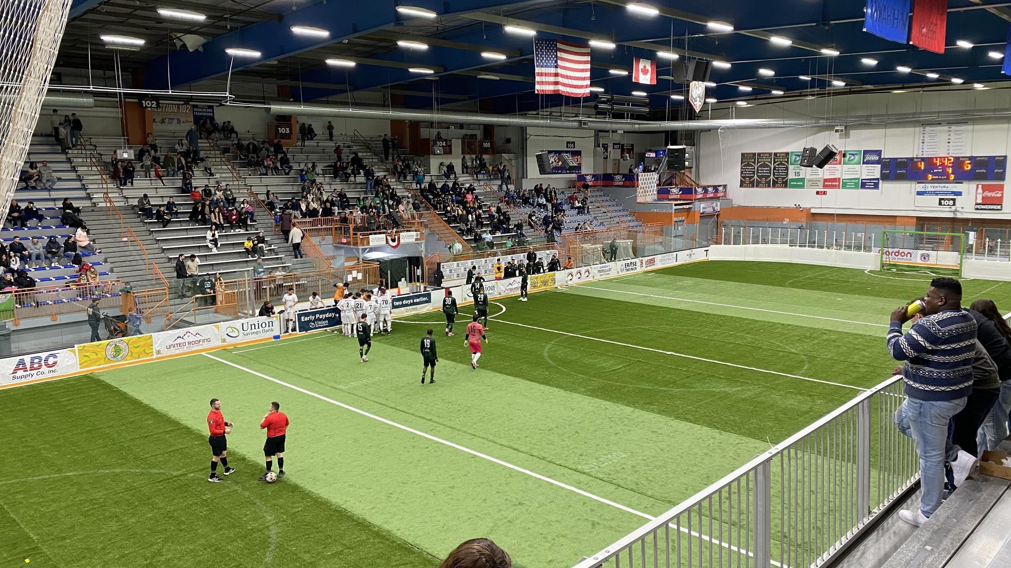 An image of the Danbury Ice Arena in soccer configuration. The normally white ice is covered in green turf