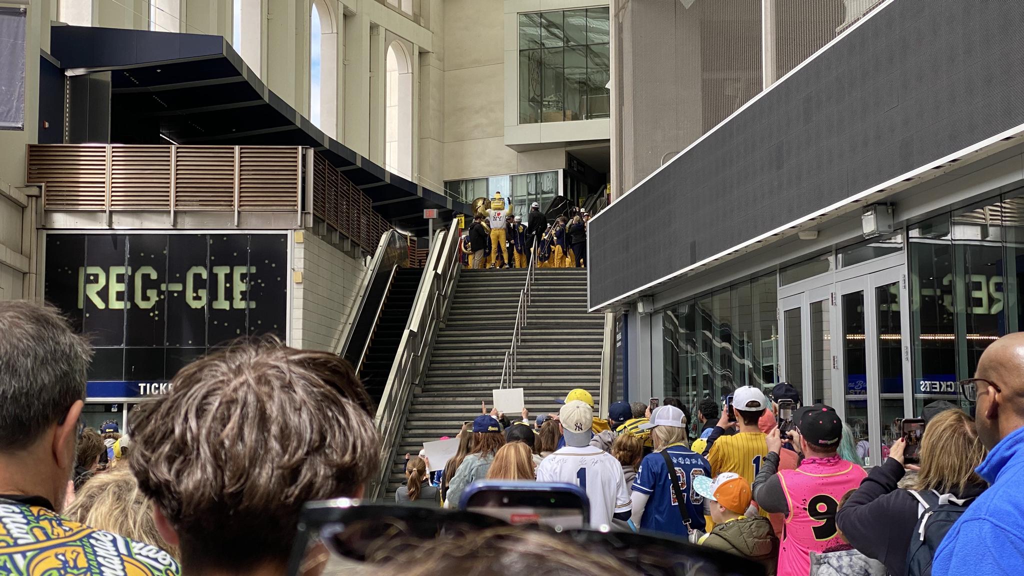The Savannah Bananas prepare to parade through a crowd of fans at Yankee Stadium