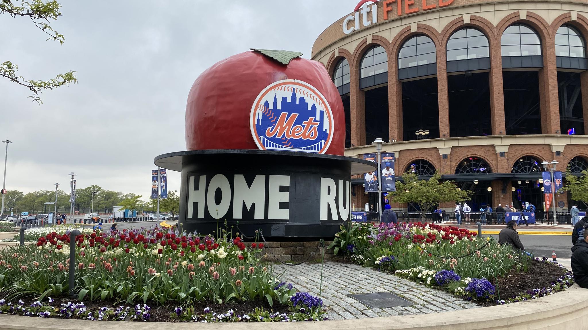 An image of the original "HOME RUN" apple outside Citi Field
