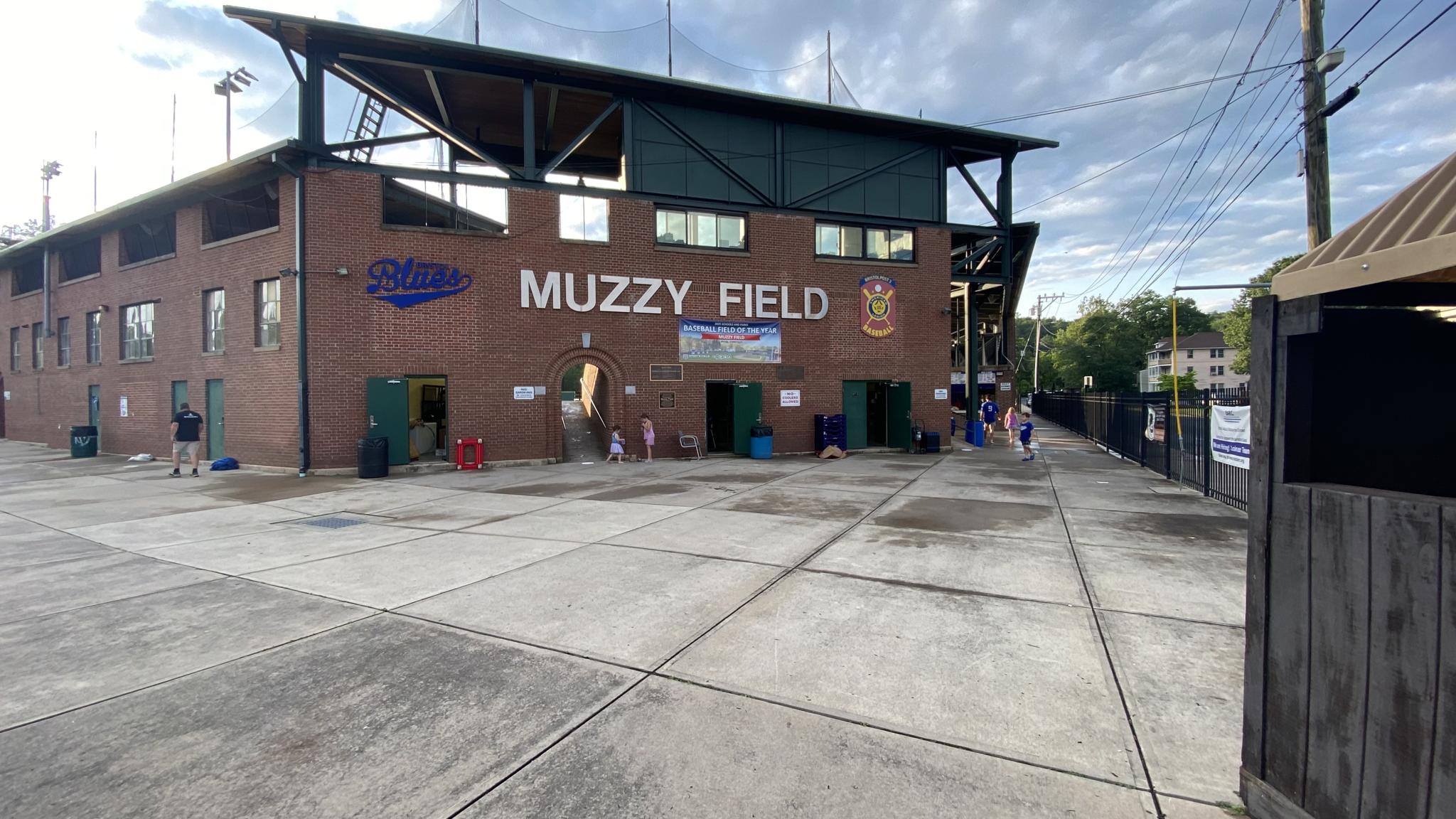 An image of the Muzzy Field grandstand from the concourse. The words "MUZZY FIELD" can be seen