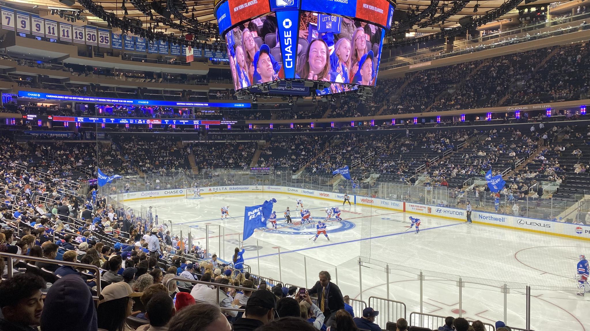 An image of a faceoff being taken at Madison Square Garden from the lower bowl