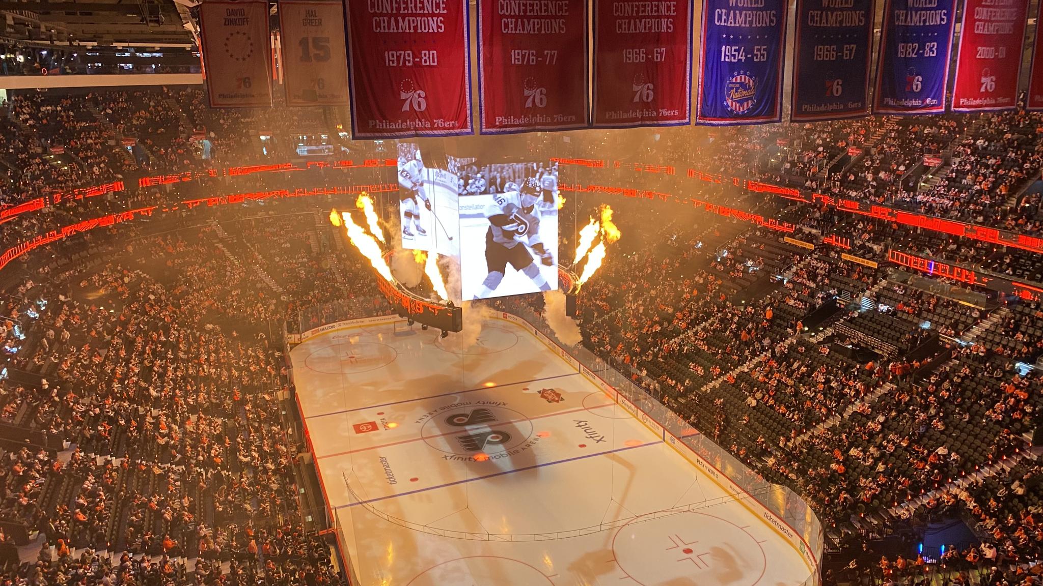 A photo of flames shooting out from the Xfinity Mobile Arena scoreboard