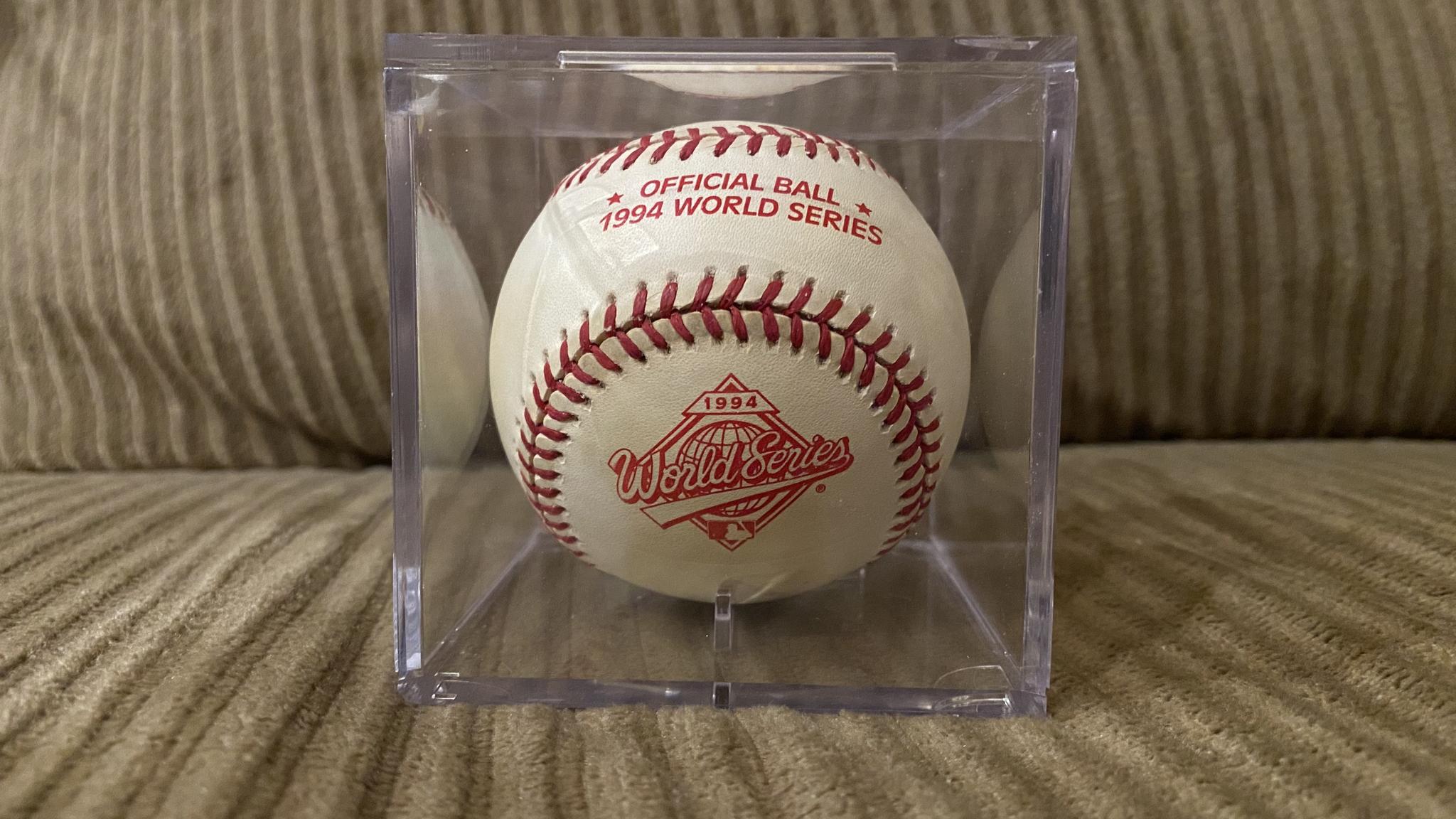 A photo of a baseball that says "OFFICIAL BALL: 1994 WORLD SERIES" and has a World Series logo
