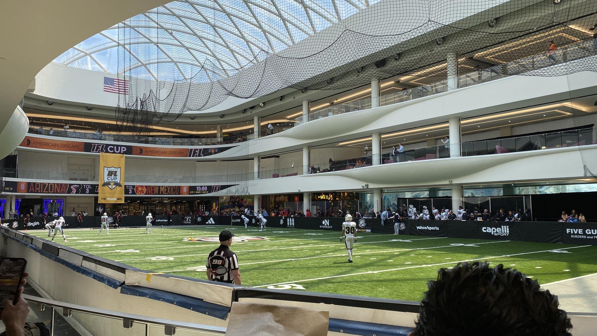 An image of the Arena at American Dream. Three tiers of viewing areas can be seen along with a glass roof.
