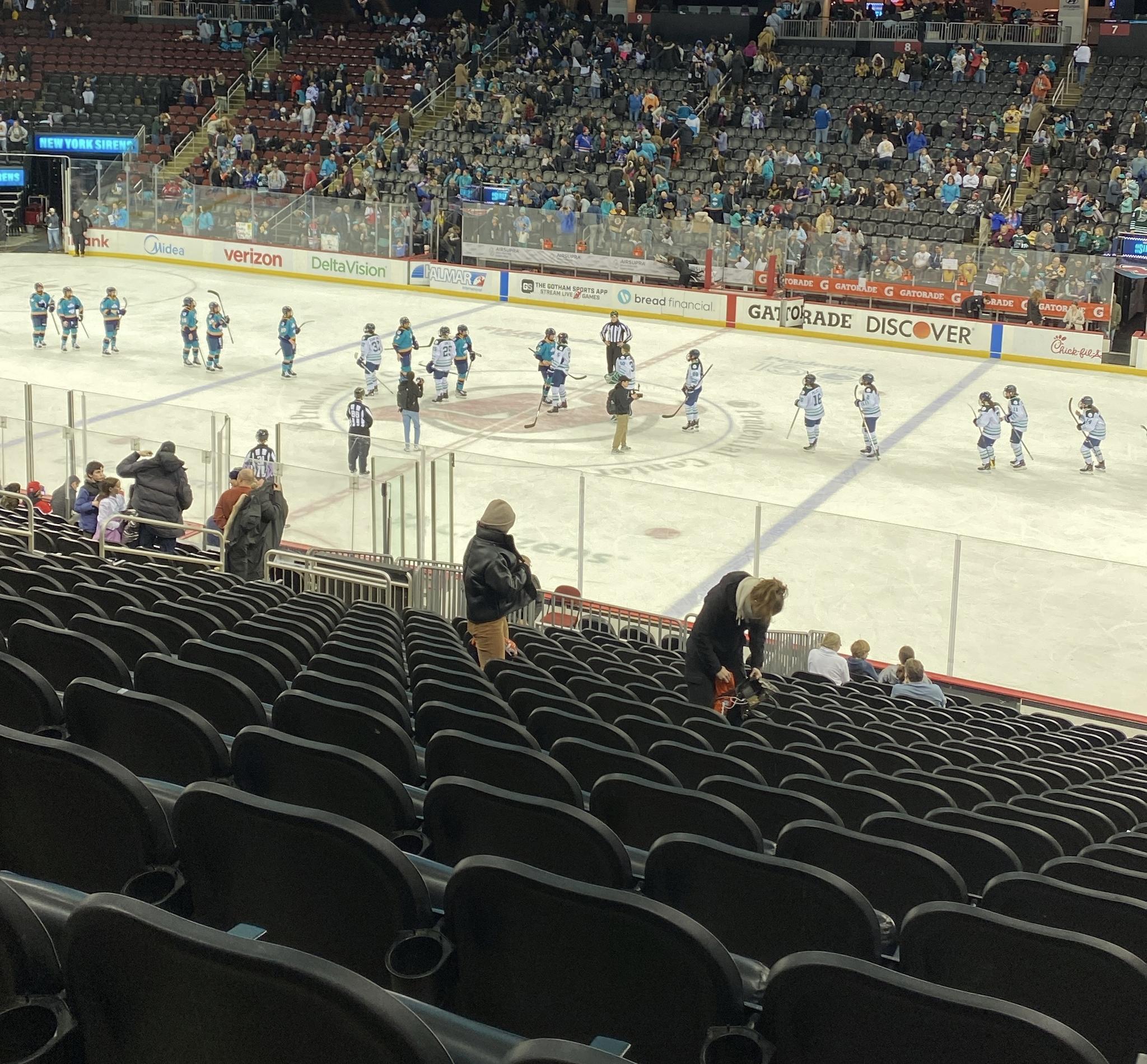 The Sirens give handshakes to their opponents after the game.