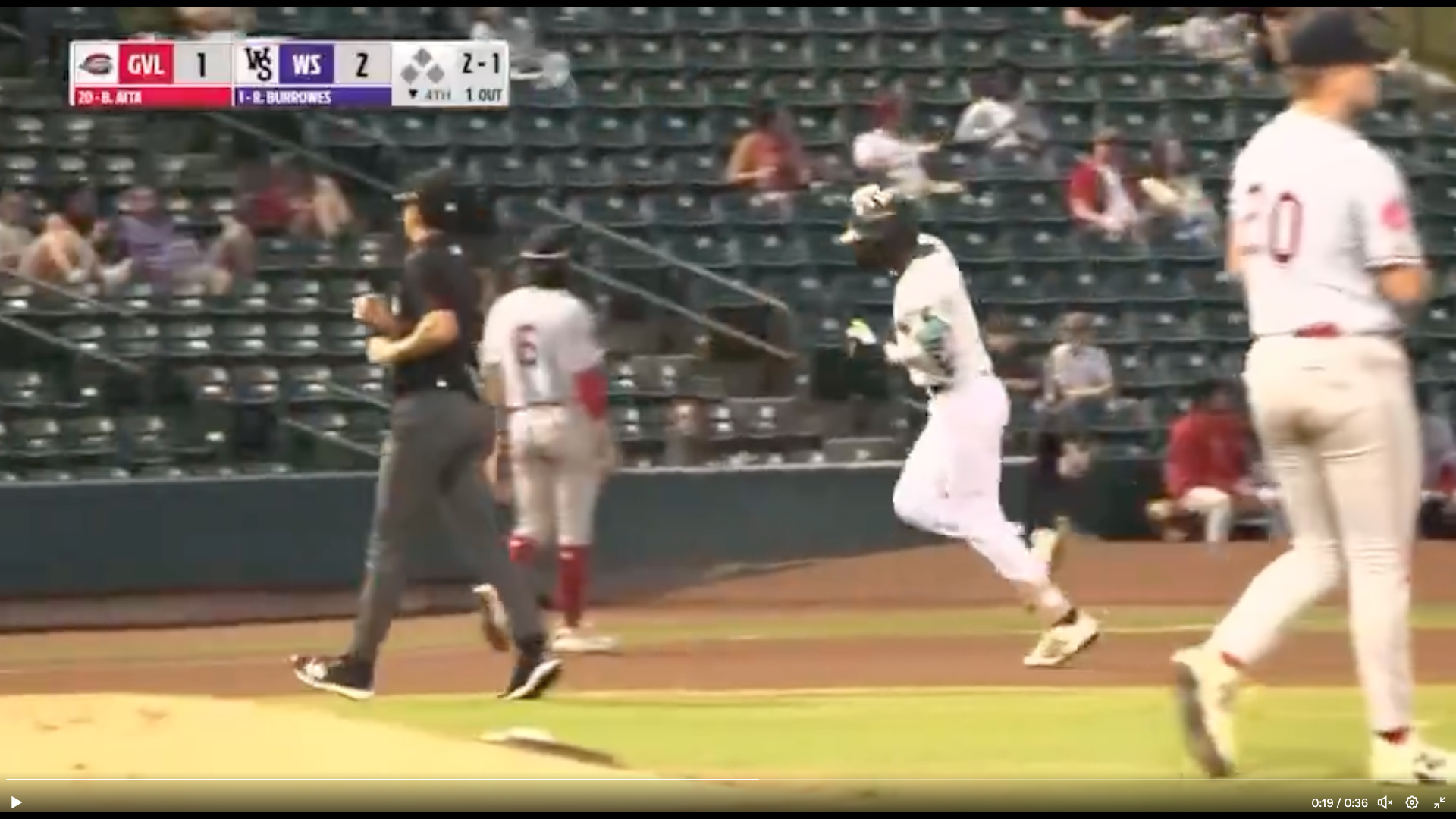 A screenshot of footage from the game. Despite the game having a listed attendance over 10,000, plenty of empty seats can be seen.